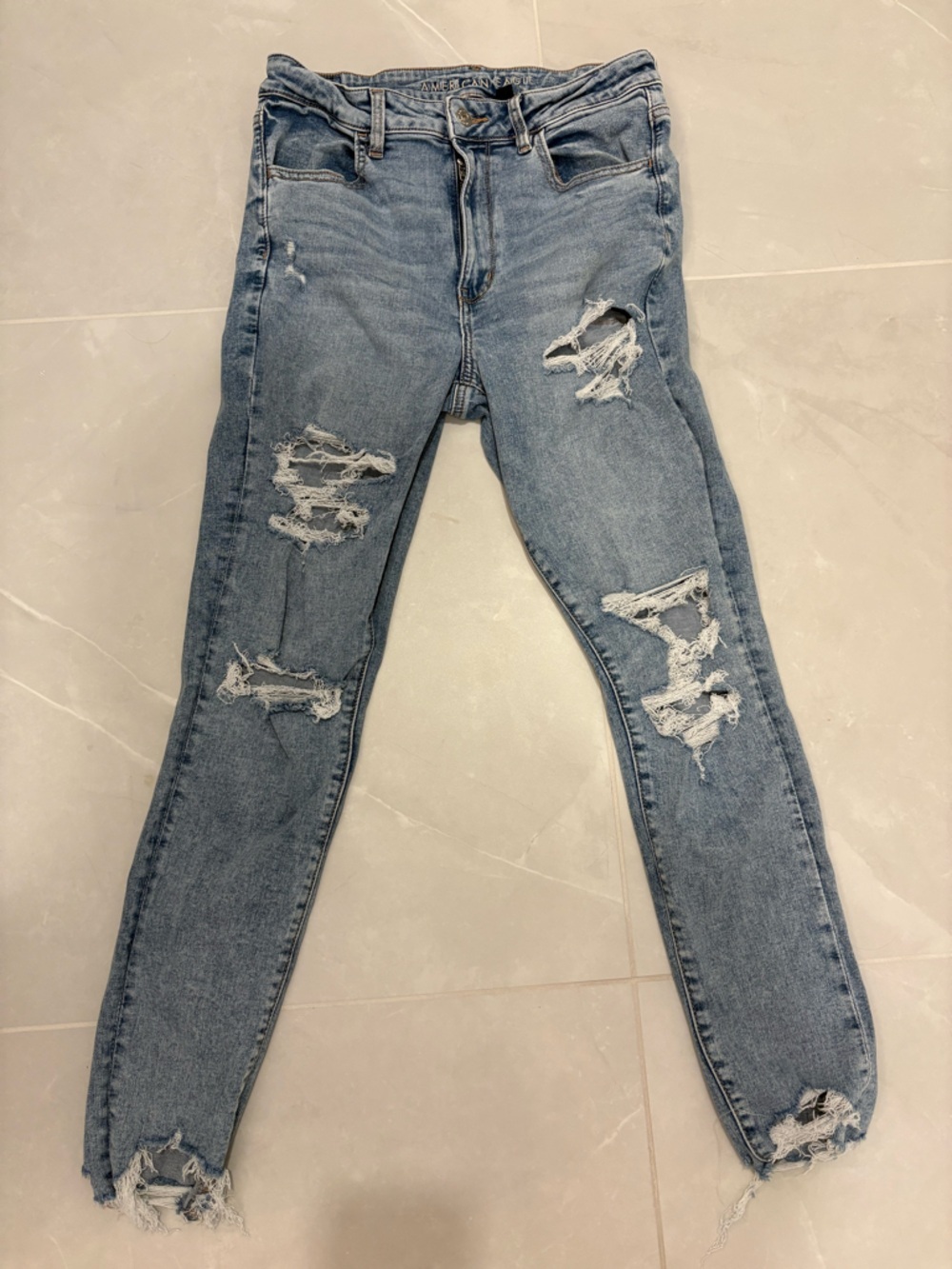 American Eagle Super High Rise Jegging Distressed Light Wash 12
